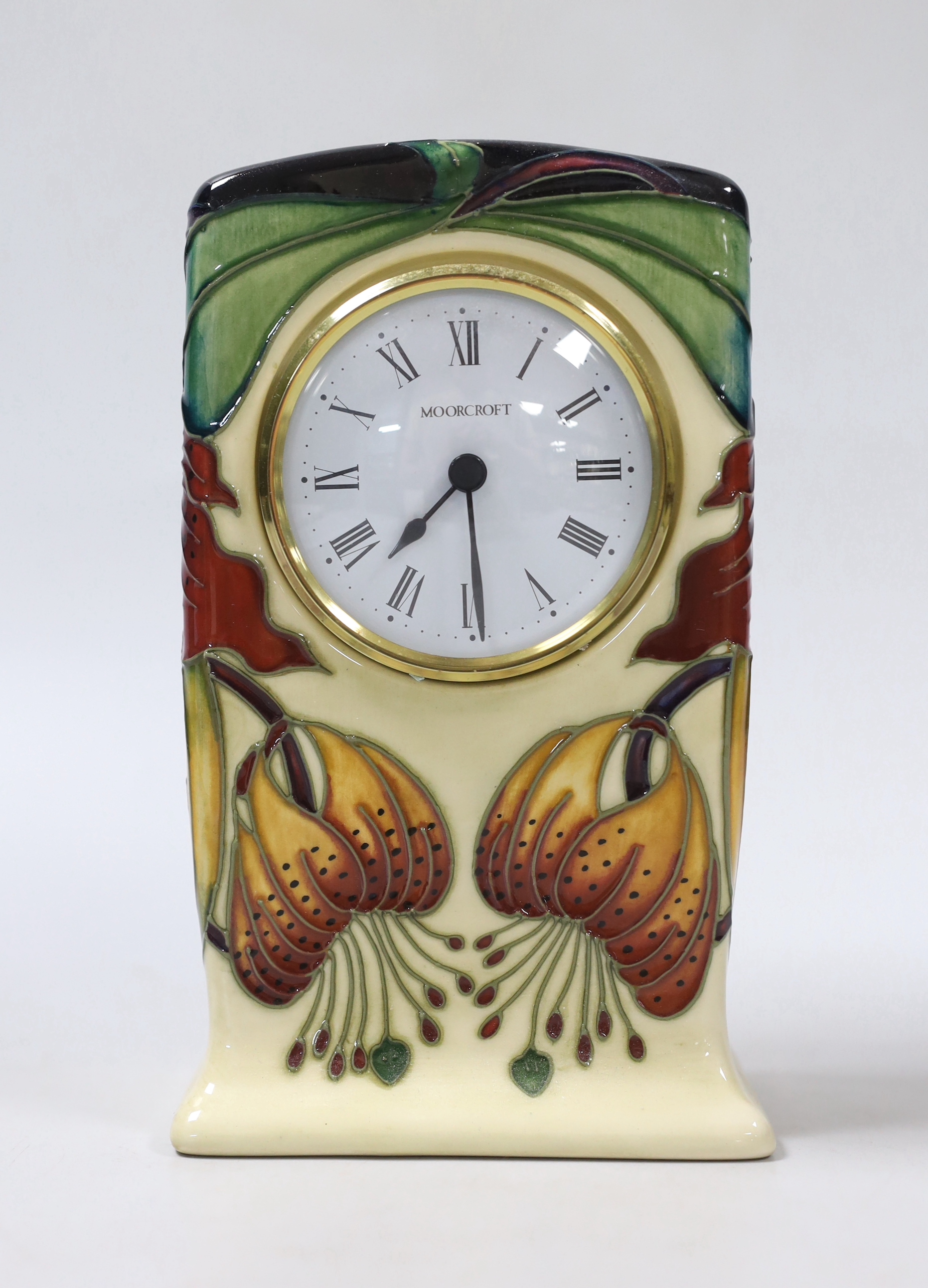 A boxed Moorcroft mantel timepiece, 16cm high